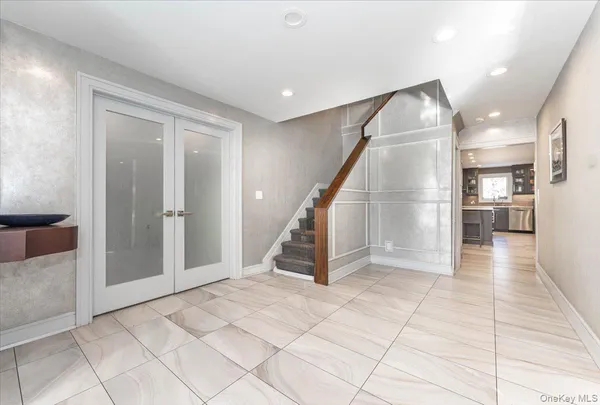 a view of a livingroom with furniture and stairs