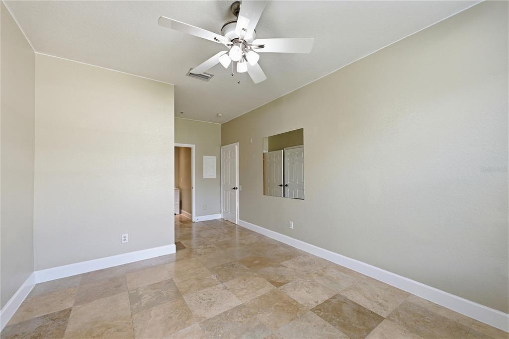 580 Brantley Terrace Way, Unit 104 Altamonte Springs, FL 32714 - Photo 21 of 32 an empty room with windows and fan