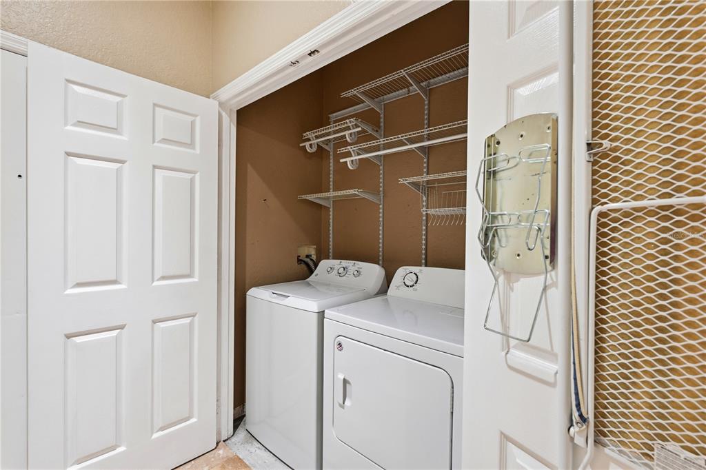 580 Brantley Terrace Way, Unit 104 Altamonte Springs, FL 32714 - Photo 24 of 32 a utility room with dryer and washer