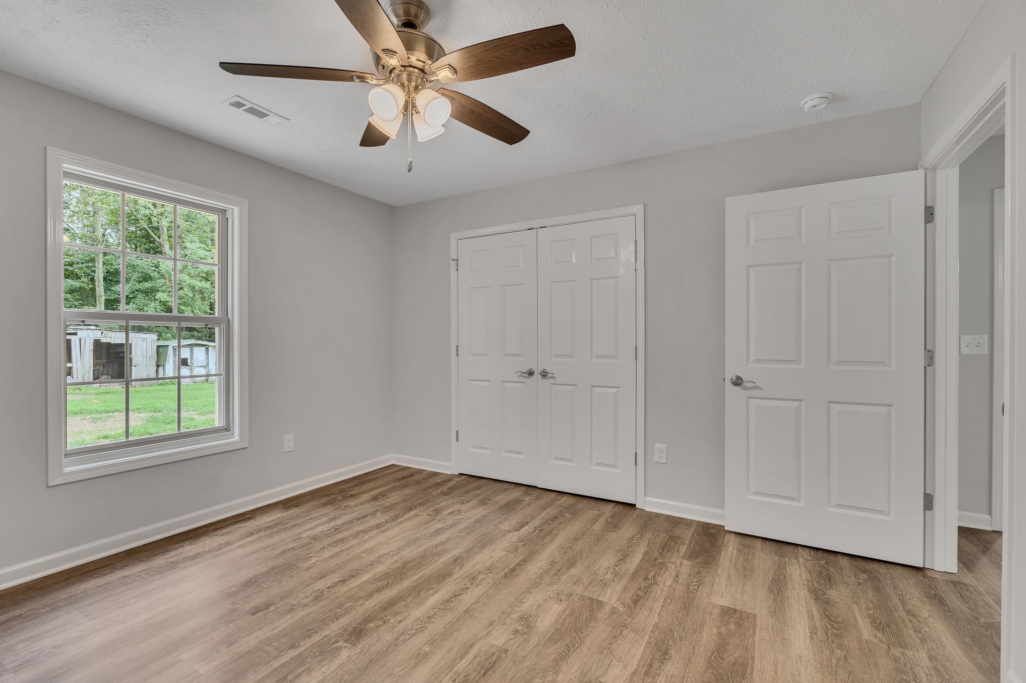 543 Paynes Church Road Winchester, TN 37398 - Photo 28 of 36 wooden floor in an empty room with a window