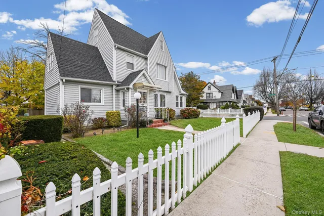 a front view of house with yard and green space
