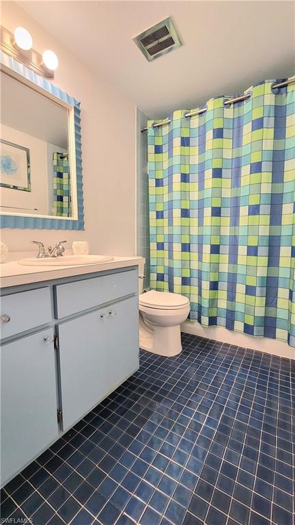 300 Valley Stream Drive, Unit A7 Naples, FL 34113 - Photo 16 of 34 a spacious bathroom with a sink a toilet a mirror and shower
