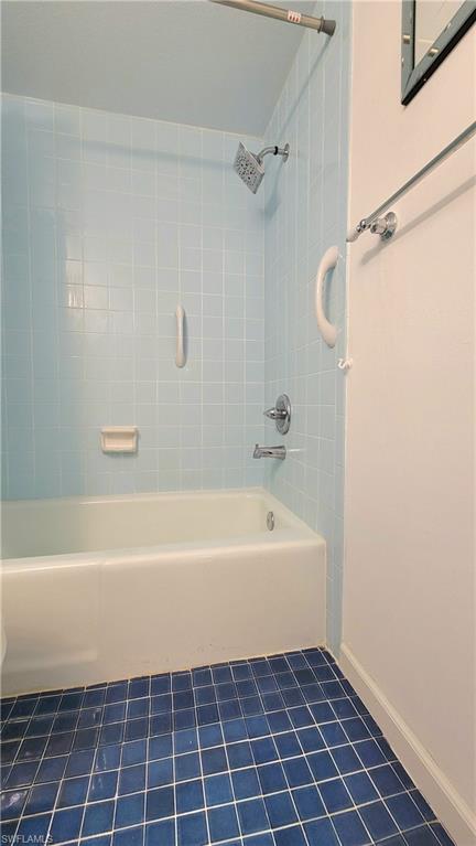 300 Valley Stream Drive, Unit A7 Naples, FL 34113 - Photo 17 of 34 a bathroom with a bathtub and a shower