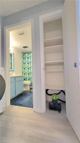 a room with a table and chandelier