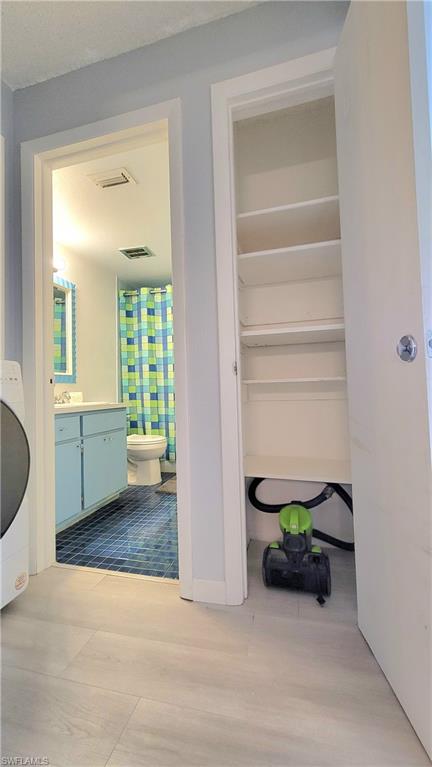 300 Valley Stream Drive, Unit A7 Naples, FL 34113 - Photo 19 of 34 a view of an entryway and wooden floor