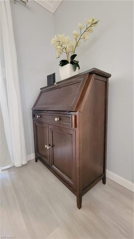 300 Valley Stream Drive, Unit A7 Naples, FL 34113 - Photo 20 of 34 a room with a table and chandelier