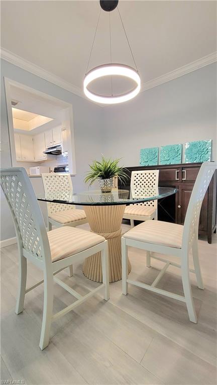 300 Valley Stream Drive, Unit A7 Naples, FL 34113 - Photo 21 of 34 a living room with a couch and chairs