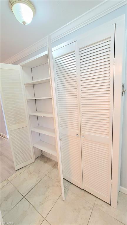 300 Valley Stream Drive, Unit A7 Naples, FL 34113 - Photo 23 of 34 a view of an empty room with a window