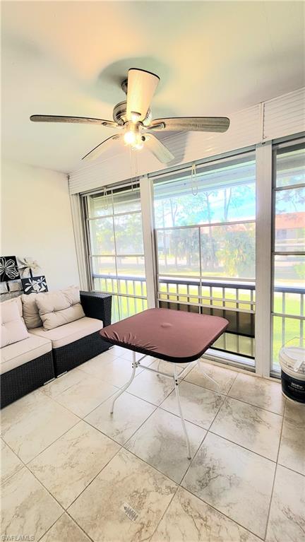 300 Valley Stream Drive, Unit A7 Naples, FL 34113 - Photo 27 of 34 a large bedroom with a large bed and a large window
