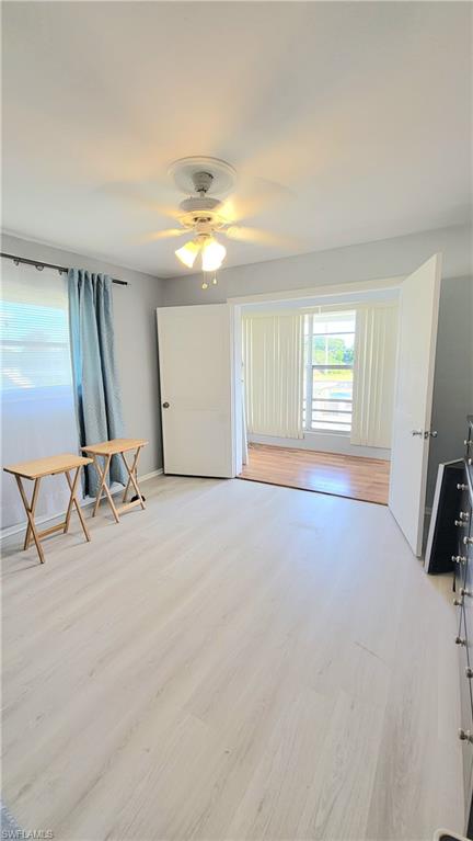 300 Valley Stream Drive, Unit A7 Naples, FL 34113 - Photo 31 of 34 a view of a livingroom with a piano and wooden floor