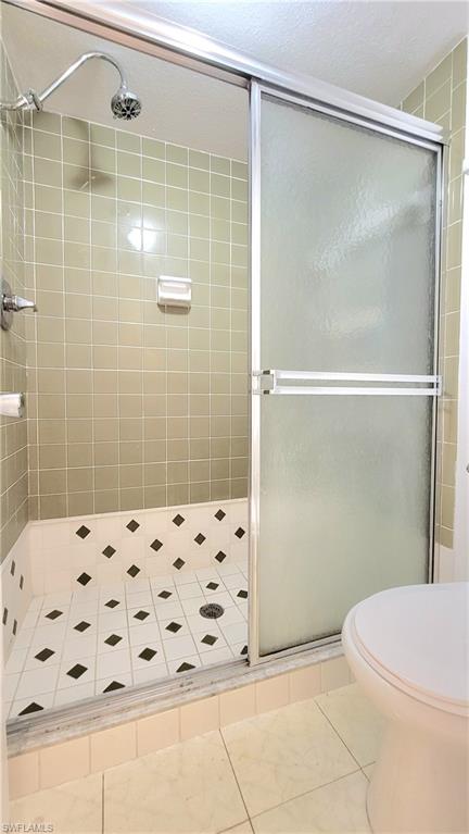 300 Valley Stream Drive, Unit A7 Naples, FL 34113 - Photo 5 of 34 a bathroom with a shower