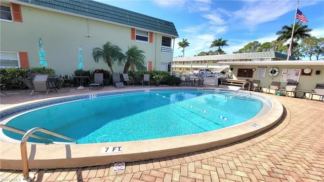 a view of a swimming pool with a patio