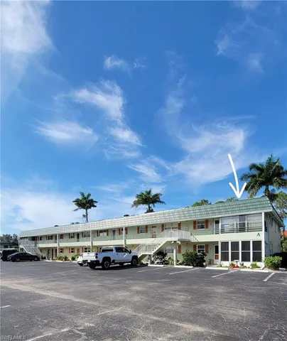 a view of multiple houses with a street