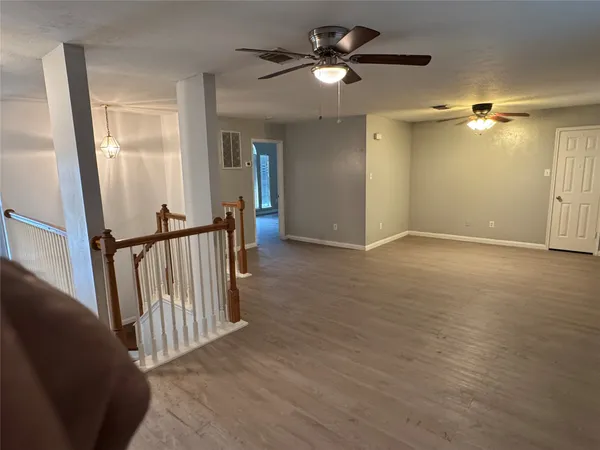 wooden floor in a hall with a mirror