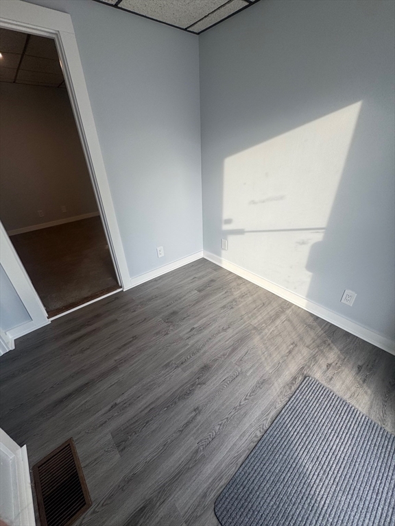 353 Cabot Street, Unit 1 Beverly, MA 01915 - Photo 16 of 18 a view of empty room with wooden floor