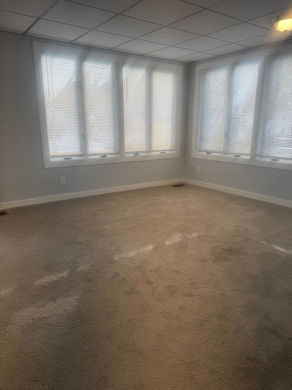 353 Cabot Street, Unit 1 Beverly, MA 01915 - Photo 3 of 18 an empty room with windows