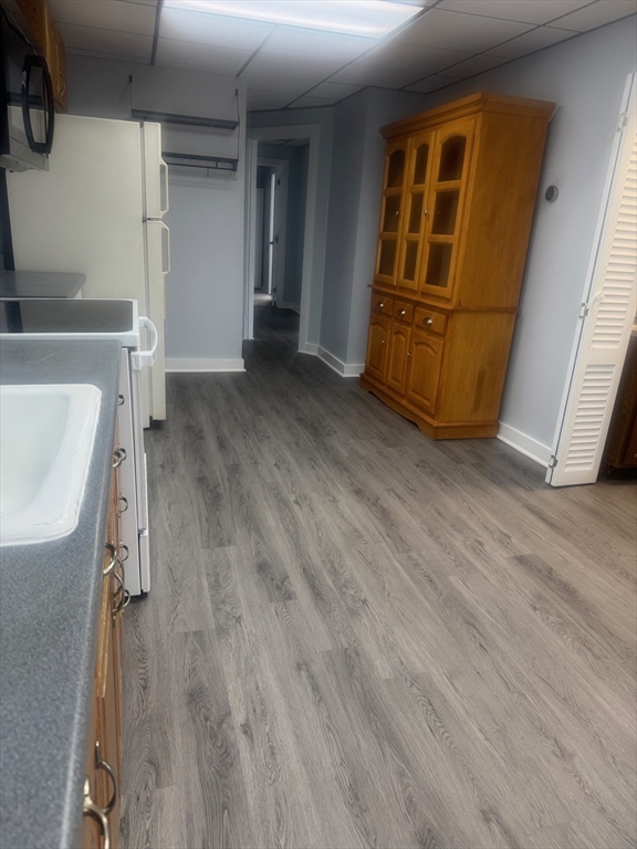 353 Cabot Street, Unit 1 Beverly, MA 01915 - Photo 6 of 18 wooden floor in an empty room