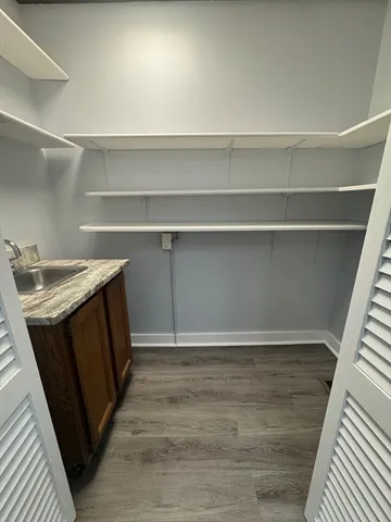 a view of a kitchen with a sink and a stove