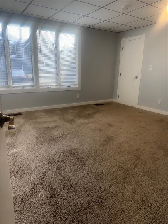 353 Cabot Street, Unit 1 Beverly, MA 01915 - Photo 9 of 18 a view of an empty room with a window