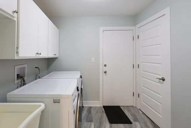 a view of storage and utility room with washer and dryer