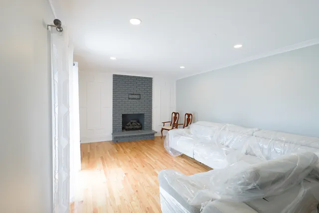 a spacious bedroom with a bed and a fireplace