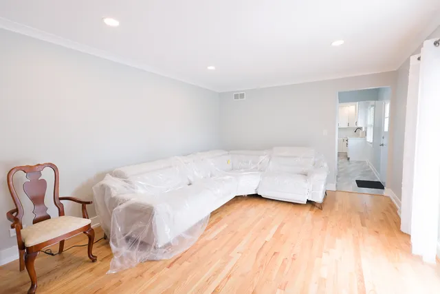 a bedroom with a bed and chair