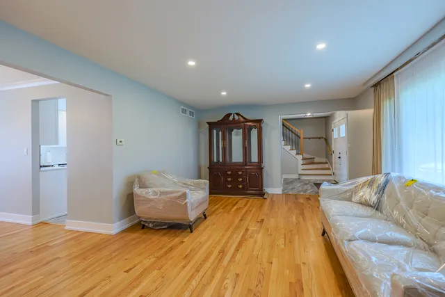 a spacious bedroom with a bed and a couch