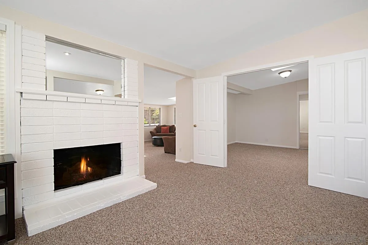13836 Powers Road Poway, CA 92064 - Photo 12 of 27 a living room with furniture and a fireplace