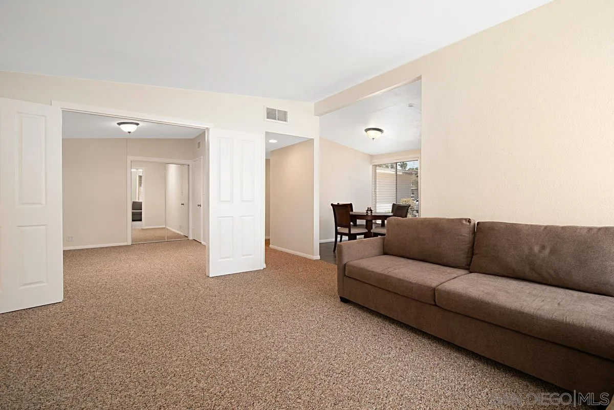 13836 Powers Road Poway, CA 92064 - Photo 13 of 27 a living room with furniture and a chandelier