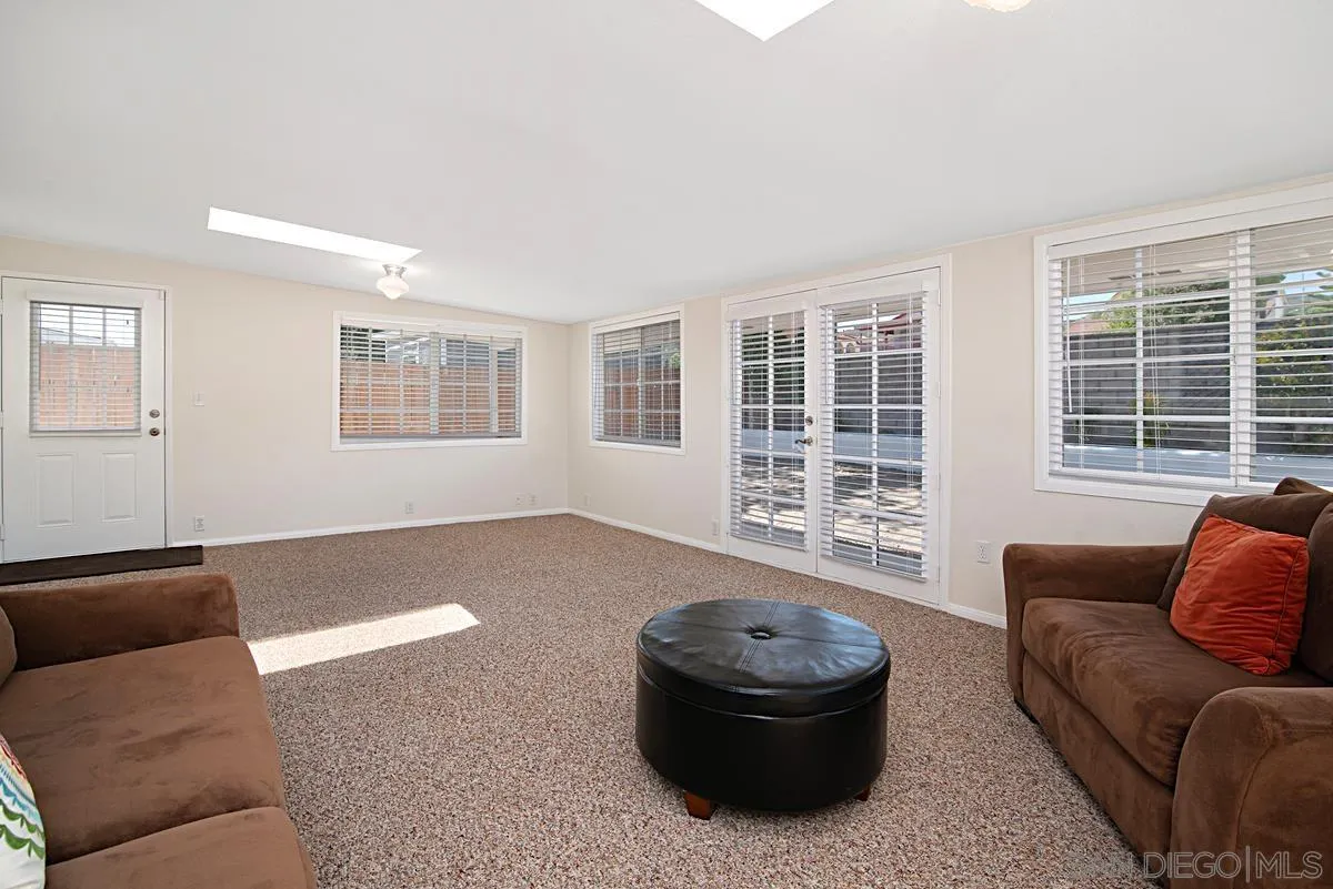 13836 Powers Road Poway, CA 92064 - Photo 16 of 27 a living room with furniture and a large window