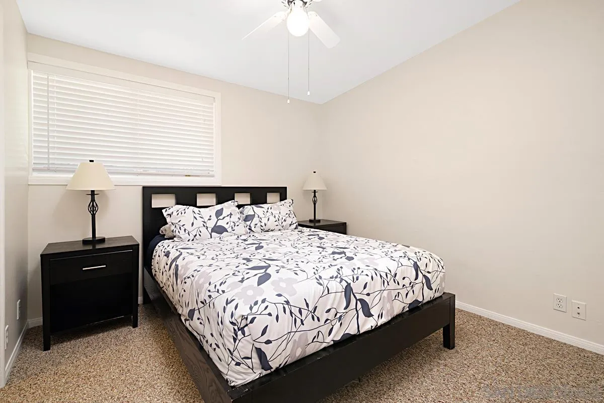 13836 Powers Road Poway, CA 92064 - Photo 18 of 27 a bedroom with a bed and window