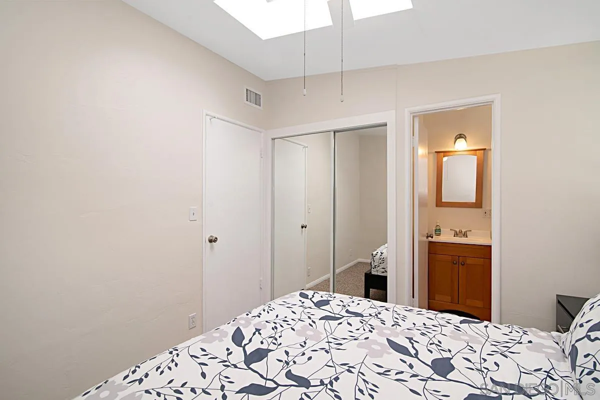 13836 Powers Road Poway, CA 92064 - Photo 20 of 27 a bedroom with a bed and a dresser