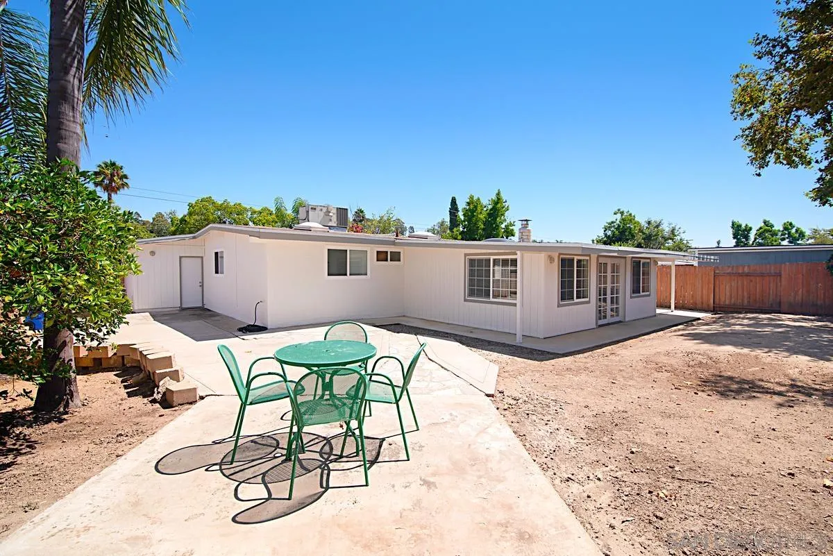 13836 Powers Road Poway, CA 92064 - Photo 26 of 27 a view of a patio with table and chairs and potted plants