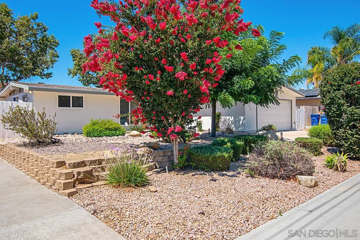 13836 Powers Road Poway, CA 92064 - Photo 3 of 27 a front view of a house with a yard and fountain