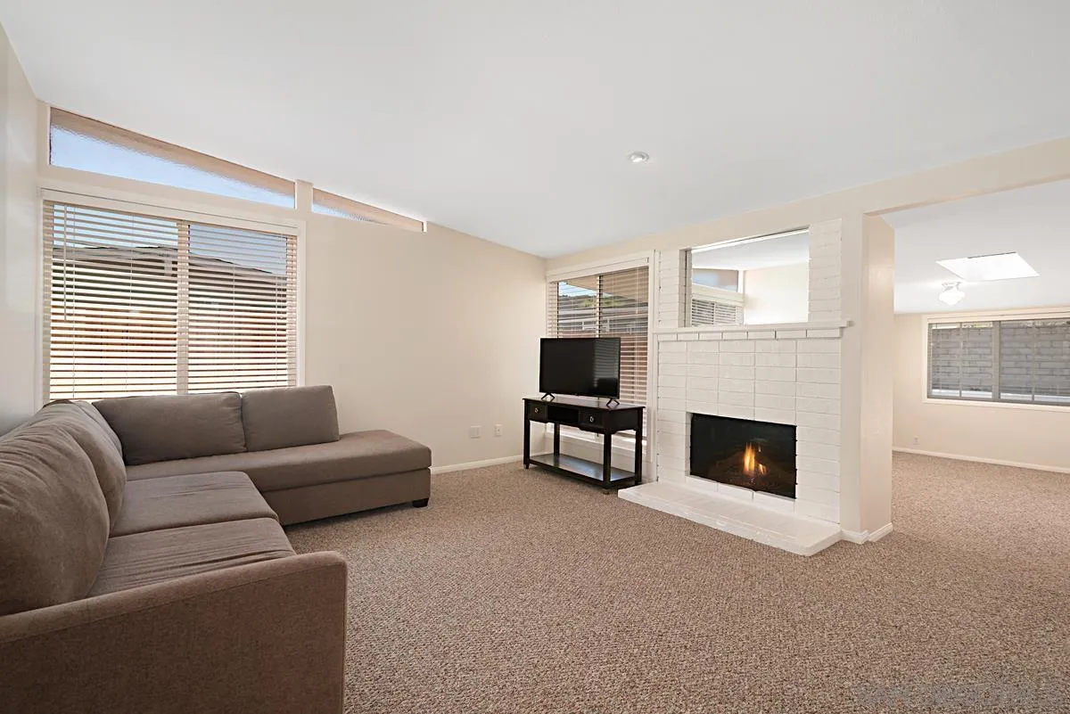 13836 Powers Road Poway, CA 92064 - Photo 4 of 27 a living room with furniture a fireplace and a flat screen tv