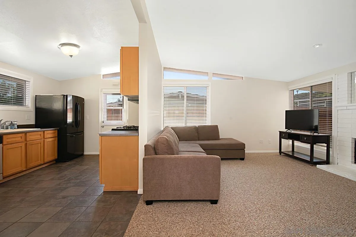 13836 Powers Road Poway, CA 92064 - Photo 6 of 27 a living room with furniture and a flat screen tv