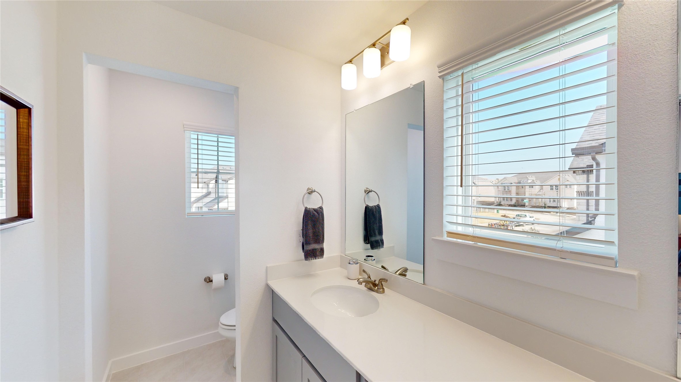 2906 ELLE Drive Grand Prairie, TX 75052 - Photo 29 of 47 a bathroom with a bathtub sink vanity and mirror