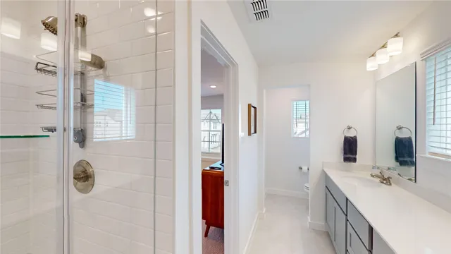 a view of a hallway with workspace and a couch