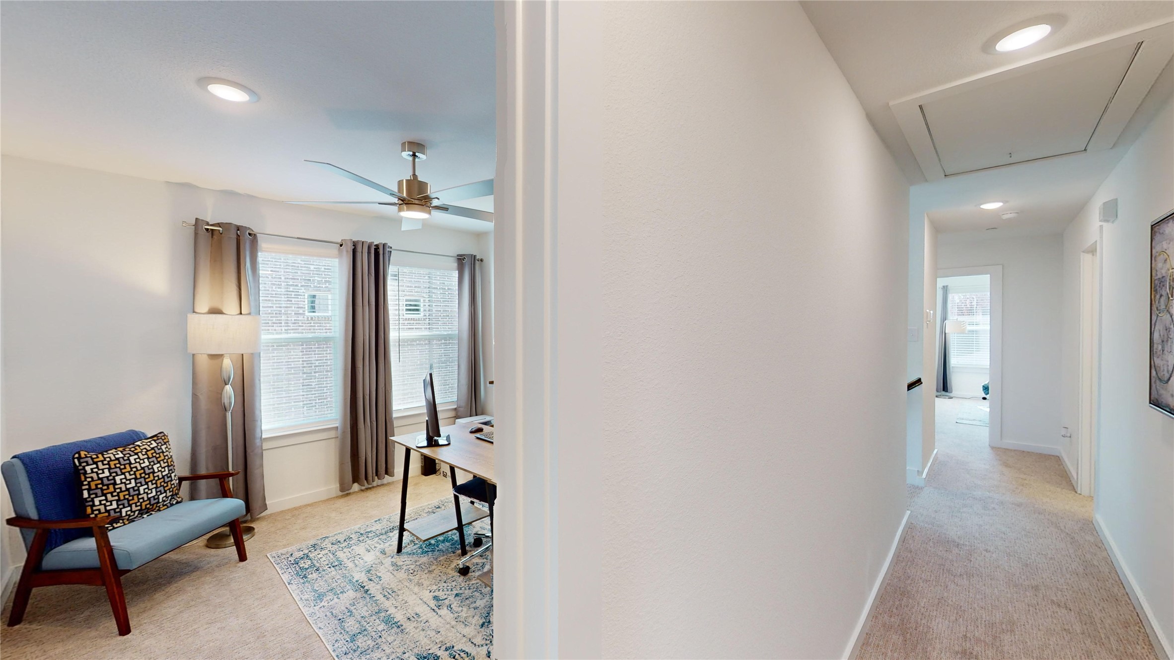 2906 ELLE Drive Grand Prairie, TX 75052 - Photo 32 of 47 a view of a hallway with workspace and a couch