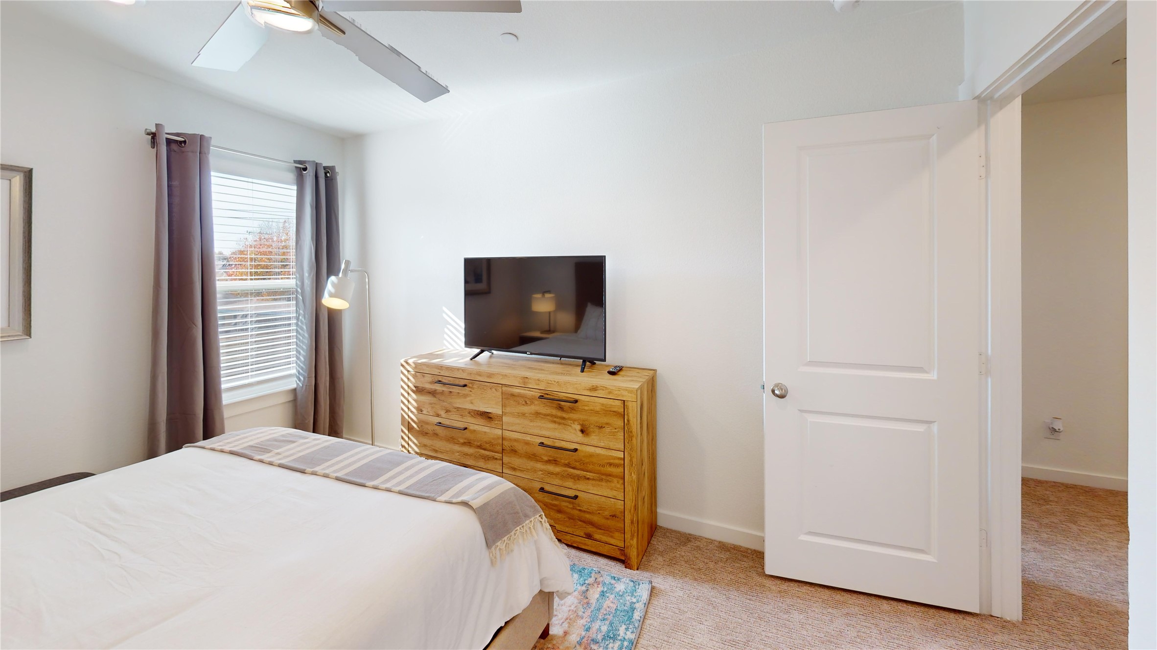 2906 ELLE Drive Grand Prairie, TX 75052 - Photo 40 of 47 a bedroom with a bed and wooden floor