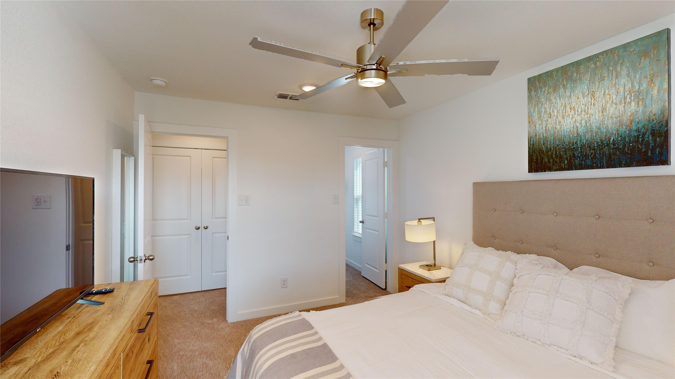 2906 ELLE Drive Grand Prairie, TX 75052 - Photo 41 of 47 a bedroom with a bed and a chandelier