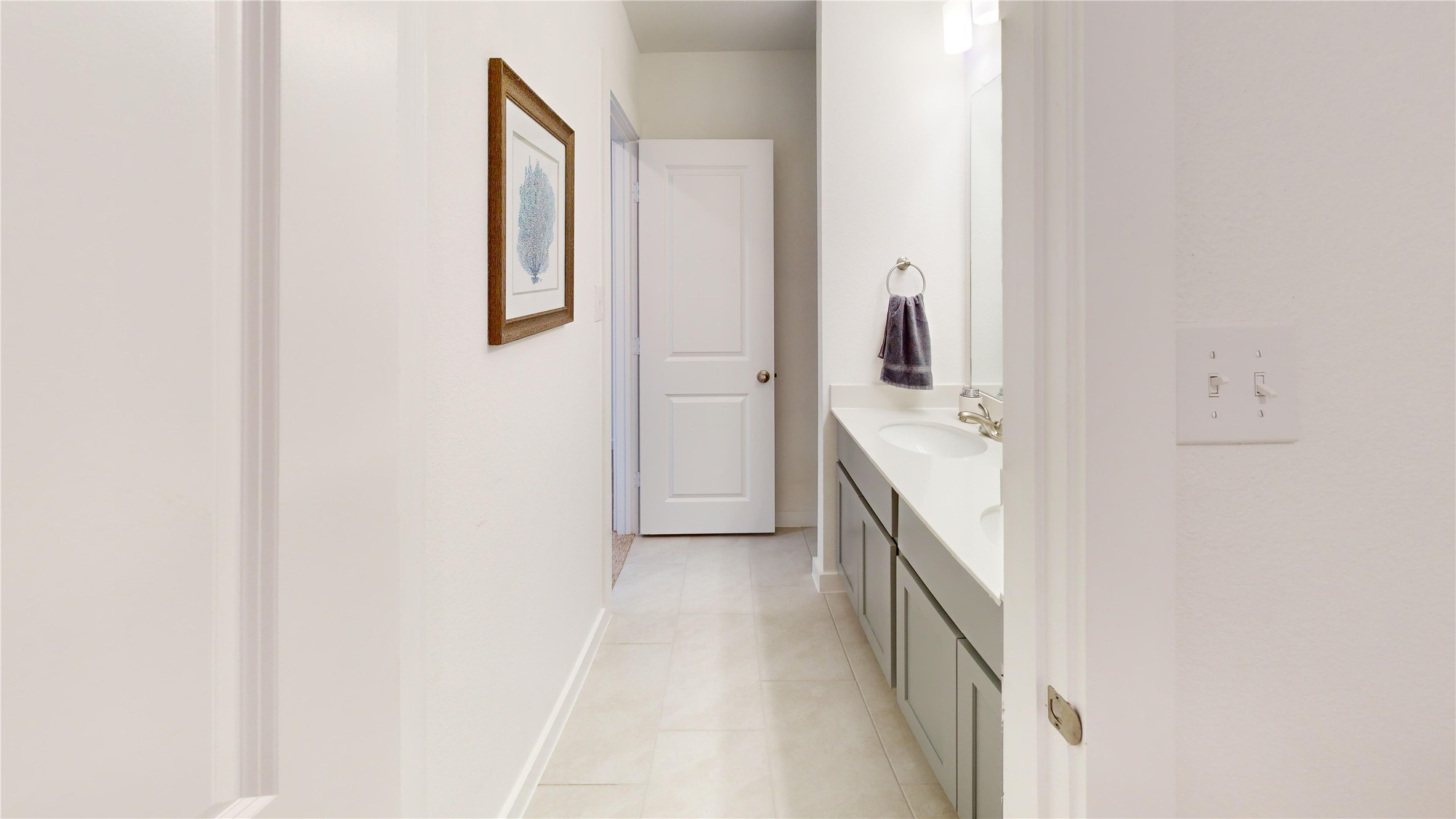 2906 ELLE Drive Grand Prairie, TX 75052 - Photo 43 of 47 a hallway with a white stove top oven and sink