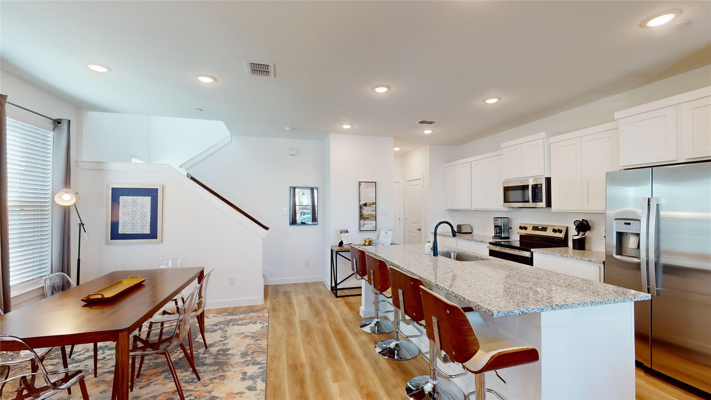 2906 ELLE Drive Grand Prairie, TX 75052 - Photo 9 of 47 a living room with stainless steel appliances kitchen island granite countertop furniture and a refrigerator