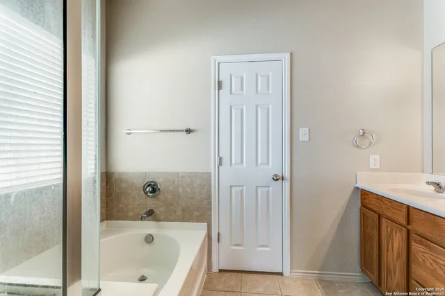 a bathroom with a bathtub and a sink