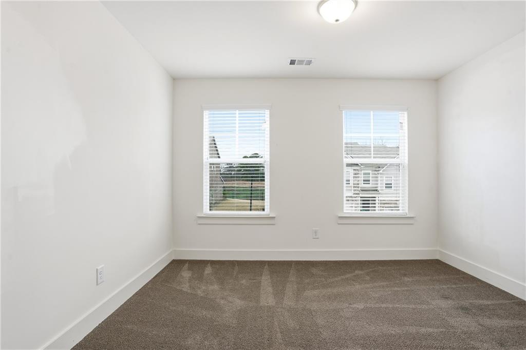 6360 Princeton Ridge Drive, Unit 6360 Lithonia, GA 30058 - Photo 15 of 16 an empty room with a window