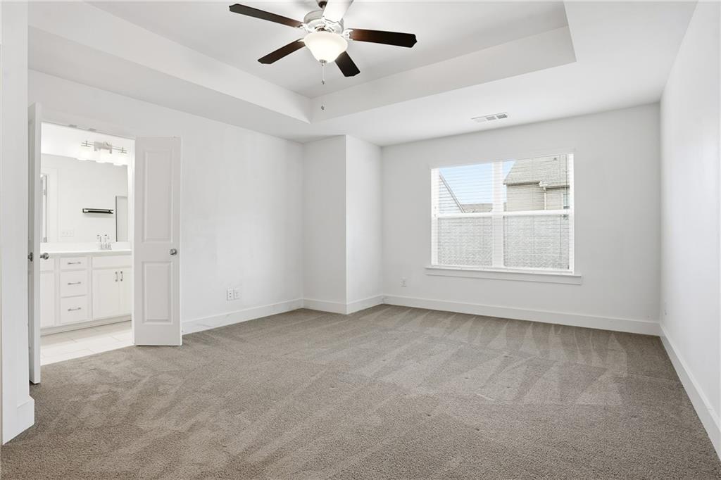6360 Princeton Ridge Drive, Unit 6360 Lithonia, GA 30058 - Photo 9 of 16 a view of an empty room with a window