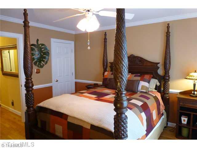 307 Georgetowne Drive Elon, NC 27244 - Photo 12 of 16 2nd Bedroom. Bedroom 2 is on the second level and features a 5 x 5 walk-in closet