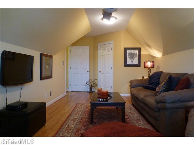 307 Georgetowne Drive Elon, NC 27244 - Photo 14 of 16 4th Bedroom. The 4th Bedroom / Bonus room offers a large walk-in closet with access to in-eave storage