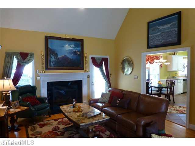 307 Georgetowne Drive Elon, NC 27244 - Photo 6 of 16 Den/Family/Great Room. Vaulted 2-story ceiling in family room w/gas log fireplace and access to rear patio