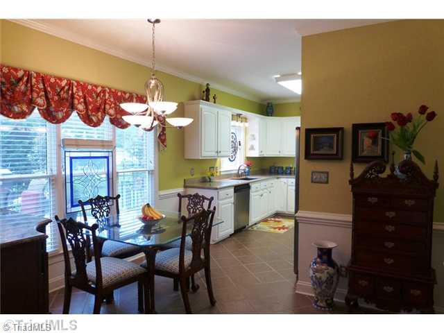 307 Georgetowne Drive Elon, NC 27244 - Photo 7 of 16 Breakfast. Tile flooring in the breakfast room with double door pantry